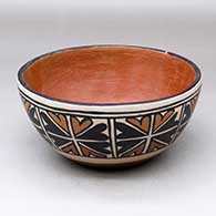 A polychrome chili bowl, polished inside and decorated around the outside with an eight-panel geometric design
 by Unknown of Santo Domingo