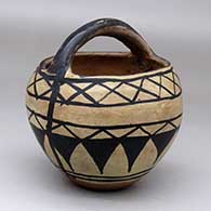 A polychrome basket decorated with a geometric design
 by Unknown of Cochiti