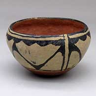 A polychrome bowl polished on the inside and decorated on the outside with a geometric design
 by Unknown of Cochiti