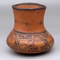 A black-on-red low-shouldered jar decorated with a geometric design
 by Unknown of Hopi