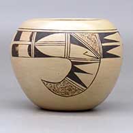 A black-on-tan bowl decorated with a two-panel bird-hanging-from-sky-band and geometric design, click or tap to see a larger version