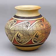 A polychrome jar with a rolled lip and decorated around the body with a migration pattern design and fire clouds
 by Fannie Nampeyo of Hopi