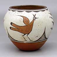 A polychrome jar decorated with a four-panel roadrunner, plant and geometric design
 by Pablita Lucero of Zia