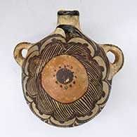 A polychrome round-backed canteen with side handles and decorated with a fine line and geometric design
 by Unknown of Zuni