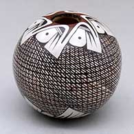 A polychrome seed pot decorated with a crosshatching and geometric design
 by Sylvia Naha of Hopi