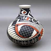 A tall neck water jar decorated with a two panel feather, checkerboard, crosshatching, spiral and geometric design
 by Juan Quezada Sr of Mata Ortiz and Casas Grandes