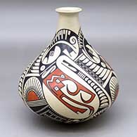 A long-necked jar decorated with a three panel serpent, feather and geometric design
 by Juan Quezada Sr of Mata Ortiz and Casas Grandes