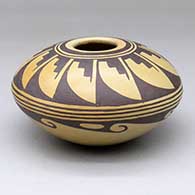 A brown-on-tan seed jar decorated with a geometric design
 by Verna Nahee of Hopi