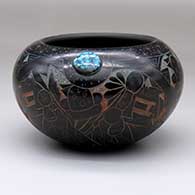 A polychrome bowl with an inlaid turquoise and a four-panel sgraffito mudhead dancers and geometric design
 by Ergil Vallo of Acoma
