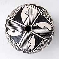 A black-on-white seed pot decorated around and above the shoulder with a four-panel fine line and geometric design
 by Rachel Concho of Acoma