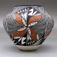 A polychrome jar decorated with a four panel fine line and geometric design, click or tap to see a larger version