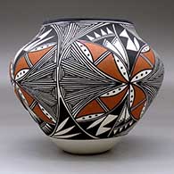 A polychrome jar decorated with a four panel fine line and geometric design, click or tap to see a larger version