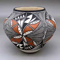A polychrome jar decorated with a four panel fine line and geometric design
 by Clara Victorino of Acoma