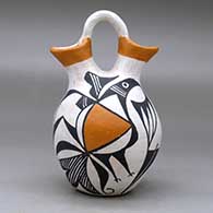 A polychrome wedding vase decorated with a two-panel bird element and geometric design, click or tap to see a larger version
