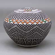 A polychrome seed pot decorated with a checkerboard and geometric design, click or tap to see a larger version
