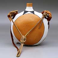 A polychrome flat-back canteen with twisted handles and decorated on the face with a fineline and geometric design, click or tap to see a larger version