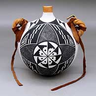 A polychrome flat-back canteen with twisted handles and decorated on the face with a fineline and geometric design
 by Sarah Garcia of Acoma