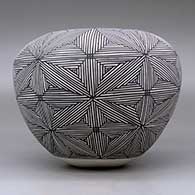 A black on white jar decorated around the body with a snowflake fineline geometric design, click or tap to see a larger version