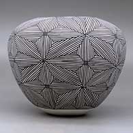 A black on white jar decorated around the body with a snowflake fineline geometric design, click or tap to see a larger version