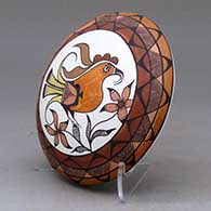 A polychrome seed pot decorated with a parrot, flower, branch and geometric design above the shoulder, click or tap to see a larger version