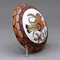 A polychrome seed pot decorated with a parrot, flower, branch and geometric design above the shoulder, click or tap to see a larger version