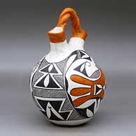 A polychrome wedding vase with a twisted bridge and decorated with a two-panel parrot, fineline and geometric design, click or tap to see a larger version