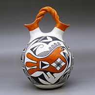 A polychrome wedding vase with a twisted bridge and decorated with a two-panel parrot, fineline and geometric design, click or tap to see a larger version