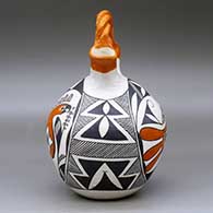 A polychrome wedding vase with a twisted bridge and decorated with a two-panel parrot, fineline and geometric design, click or tap to see a larger version