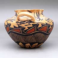 A polychrome high-shoulder jar with handles and a pie crust rim, decorated with a lizard, fineline and geometric design, click or tap to see a larger version