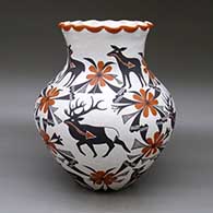 A large polychrome jar with a pie crust rim and decorated with a deer-with-heart-line and geometric design
 by Mildred Antonio of Acoma