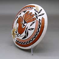 A polychrome seed pot decorated above the shoulder with a parrot, branch, leaf, flower and geometric design, click or tap to see a larger version