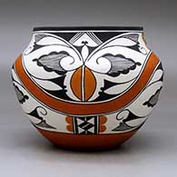 A polychrome jar decorated with a four panel rainbow and geometric design, click or tap to see a larger version