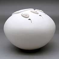 A white seed pot decorated with a sculpted bear paw applique, click or tap to see a larger version
