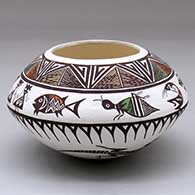 A polychrome bowl decorated with bands of wildlife and geometric design
 by Carolyn Concho of Acoma