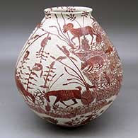 A red on white jar with a flared rim and decorated with a sgraffito wildlife, nature and geometric design
 by Leonel Lopez Sr of Mata Ortiz and Casas Grandes