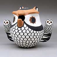 A polychrome owl storyteller figure with two chicks, click or tap to see a larger version