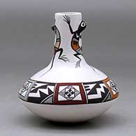 A small polychrome jar with a tall neck and decorated with lizard head appliques and a lizard and geometric design, click or tap to see a larger version