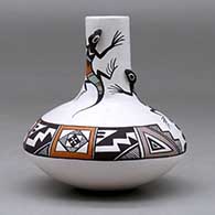 A small polychrome jar with a tall neck and decorated with lizard head appliques and a lizard and geometric design, click or tap to see a larger version