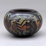 A polychrome bowl decorated with a sgraffito dancer and geometric design
 by Ergil Vallo of Acoma