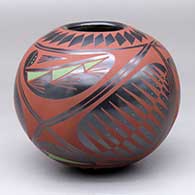 A polychrome jar decorated with a four-panel geometric design
 by Efrain Lucero of Mata Ortiz and Casas Grandes