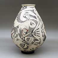 A large polychrome jar with a rolled lip and decorated with a bird element, fish and geometric design, click or tap to see a larger version