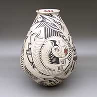 A large polychrome jar with a rolled lip and decorated with a bird element, fish and geometric design
 by Manuel Rodriguez of Mata Ortiz and Casas Grandes