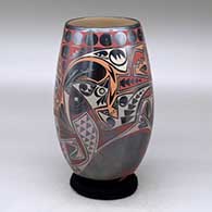 A polychrome cylinder decorated with a fish, bird, lizard and geometric design
 by Eli Navarrete of Mata Ortiz and Casas Grandes