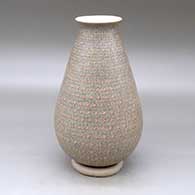 A tall polychrome vase with a flared rim and decorated with bands on tiny fineline graphic design
 by Oralia Lopez of Mata Ortiz and Casas Grandes