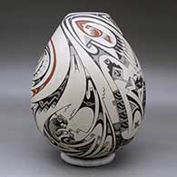 A polychrome jar decorated with a wildlife and geometric design, click or tap to see a larger version