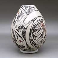 A polychrome jar decorated with a wildlife and geometric design, click or tap to see a larger version