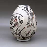 A polychrome jar decorated with a wildlife and geometric design, click or tap to see a larger version