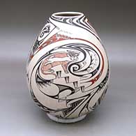 A polychrome jar decorated with a wildlife and geometric design
 by Manuel Rodriguez of Mata Ortiz and Casas Grandes