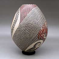 A polychrome jar decorated with a painted wildlife and geometric design, click or tap to see a larger version