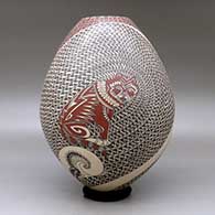 A polychrome jar decorated with a painted wildlife and geometric design, click or tap to see a larger version